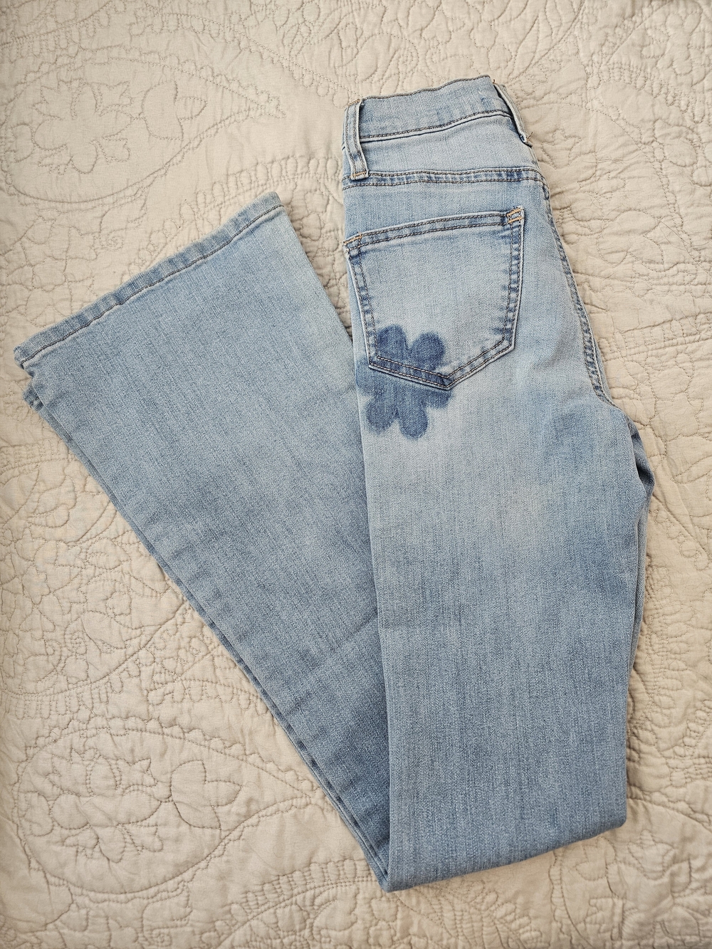 Light Wash Flare Jeans with Subtle Floral Detail